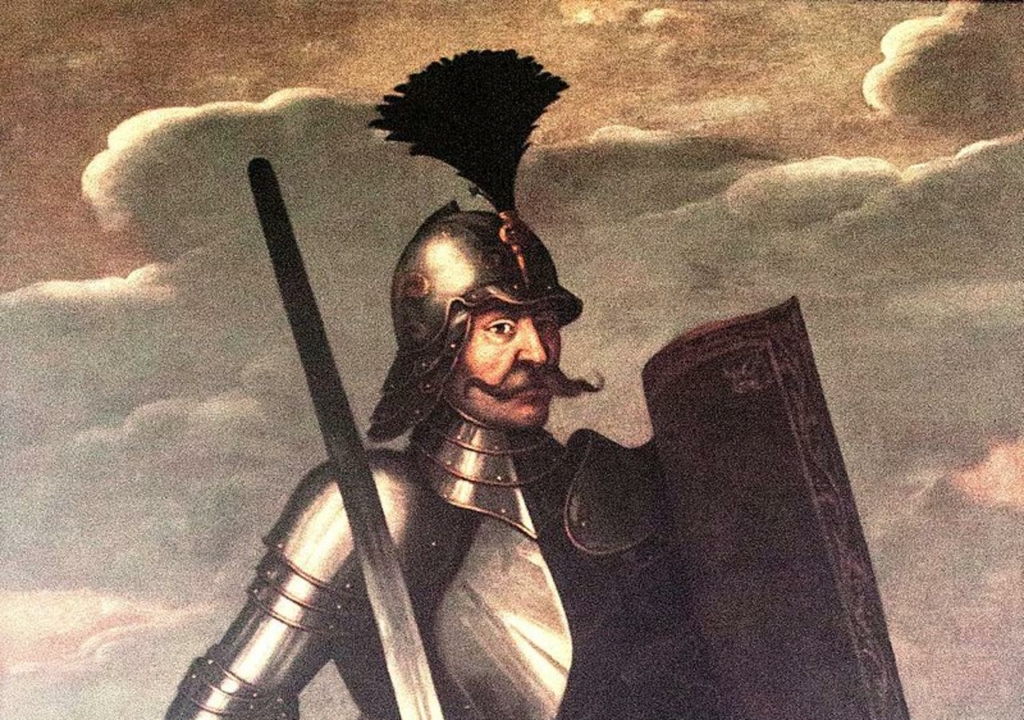 Páncélos Hunyadi János egész alakos portréja karddal és pajzzsal